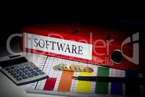 Software on red business binder