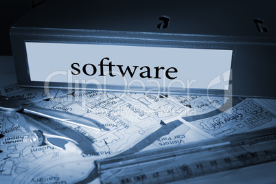Software on blue business binder