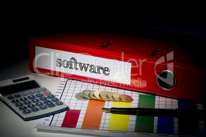 Software on red business binder