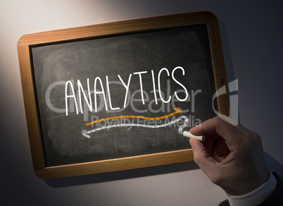 Hand writing Analytics on chalkboard