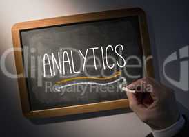 Hand writing Analytics on chalkboard