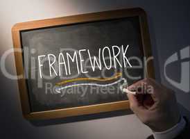 Hand writing Framework on chalkboard