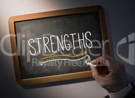 Hand writing Strengths on chalkboard