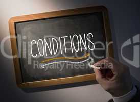 Hand writing Conditions on chalkboard