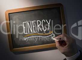 Hand writing Energy on chalkboard