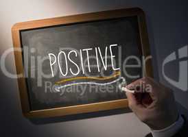 Hand writing Positive on chalkboard