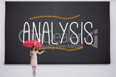 Businesswoman holding umbrella against the word analysis