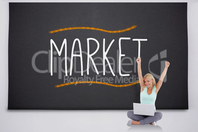 Cheering blonde with laptop against the word market