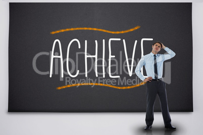 Thinking businessman against the word achieve