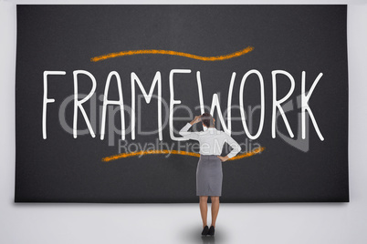 Businesswoman considering the word framework