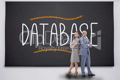 Business people standing against the word database
