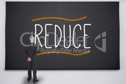 Businessman reading the word reduce