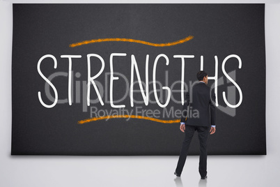 Businessman reading the word strengths