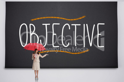 Businesswoman holding umbrella against the word objective