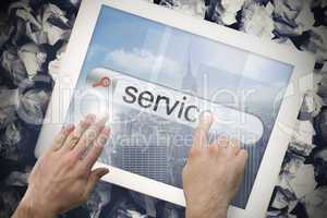 Hand touching service on search bar on tablet screen