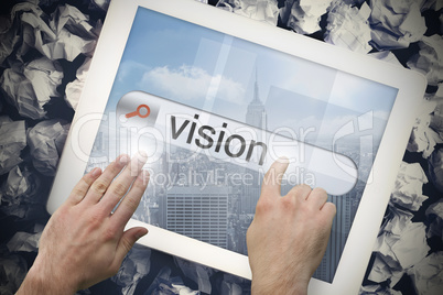Hand touching vision on search bar on tablet screen