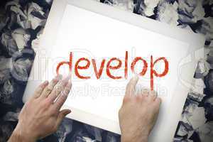 Hand touching develop on search bar on tablet screen