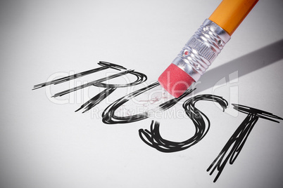 Pencil erasing the word Trust