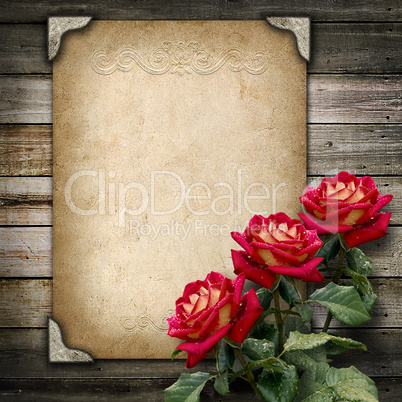 old vintage frame for photos and a bouquet of red roses