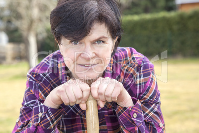 woman with spade in garden