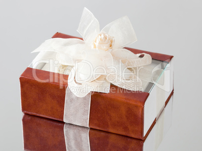 The gift box with a brown cover