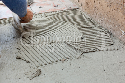 Tiler works with flooring