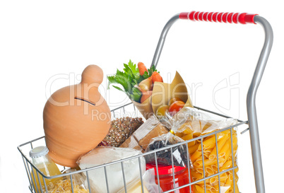Shopping cart full with money box and food products