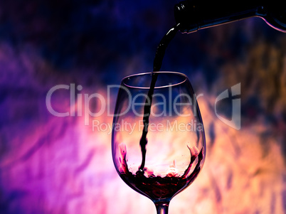 red wine poured into wineglass