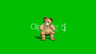 cartoon teddy bear is sitting and tells - green screen