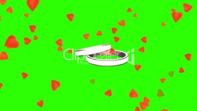 rotating wedding rings between falling hearts - green screen