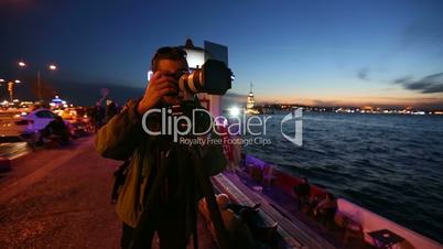 photographer shooting at night city 3