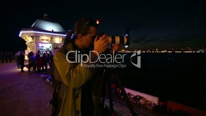 photographer shooting at night city 1