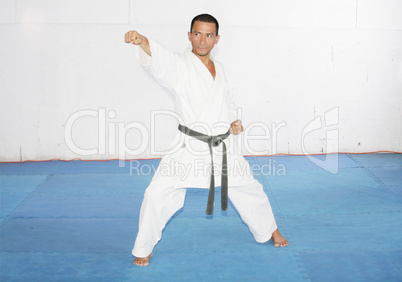 man training karate in the gym