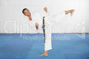 man practicing martial arts at the gym