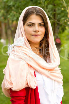 young woman in pink scarf