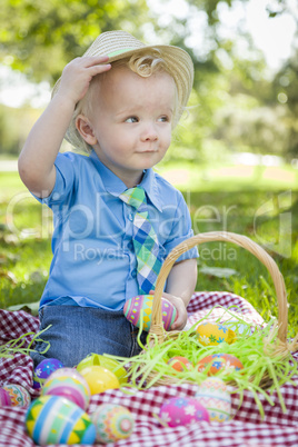 Cute Little Boy Outside Holding Easter Eggs Tips His Hat