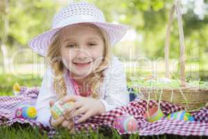 Cute Young Girl Wearing Hat Enjoys Her Easter Eggs