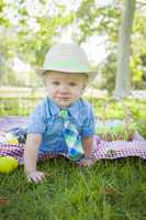 Cute Little Boy Smiles With Easter Eggs Around Him