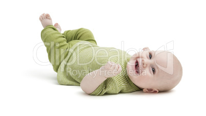 happy toddler lying on his back