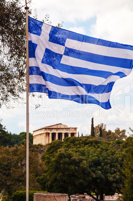 Greek flag and Temple of Hephaestus in Athens, Greece