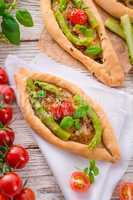 home-baked pide with green asparagi