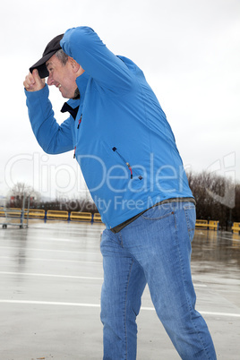 man running in rainy stormy weather
