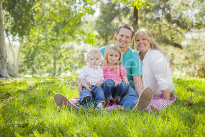 Young Attractive Family Portrait in the Park