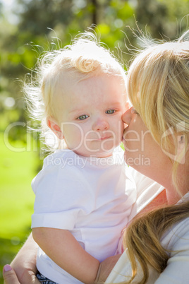 Young Mother Holding Her Adorable Baby Boy