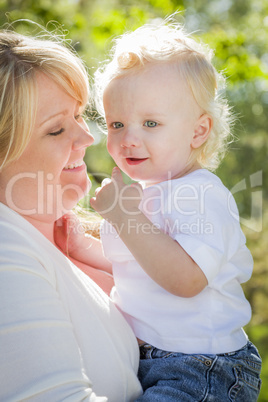 Young Mother Holding Her Adorable Baby Boy