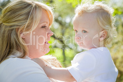 Young Mother Holding Her Adorable Baby Boy