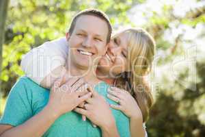 Young Attractive Couple Hugging in the Park