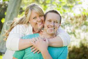 Young Attractive Couple Hugging in the Park