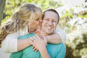 Young Attractive Couple Hugging in the Park