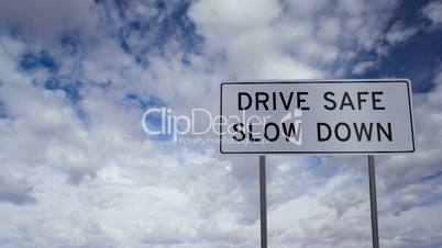 Sign Drive Safe Slow Down Clouds Timelapse